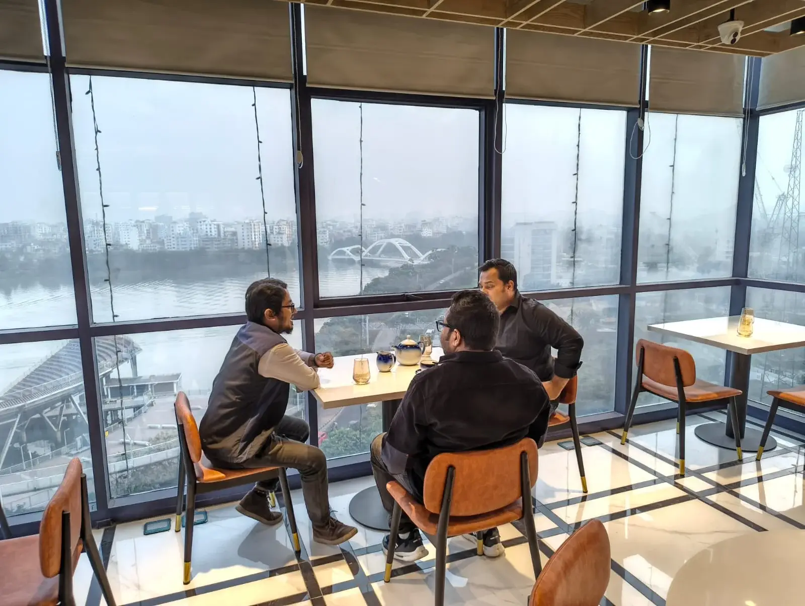 Business meeting restaurant Dhaka with guests by lakeview