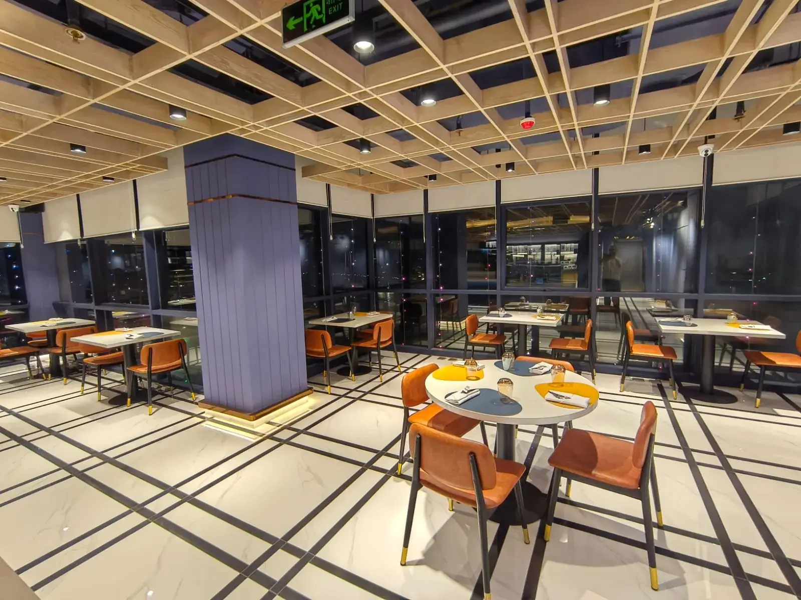 Family restaurant Dhaka seating near large window pillar