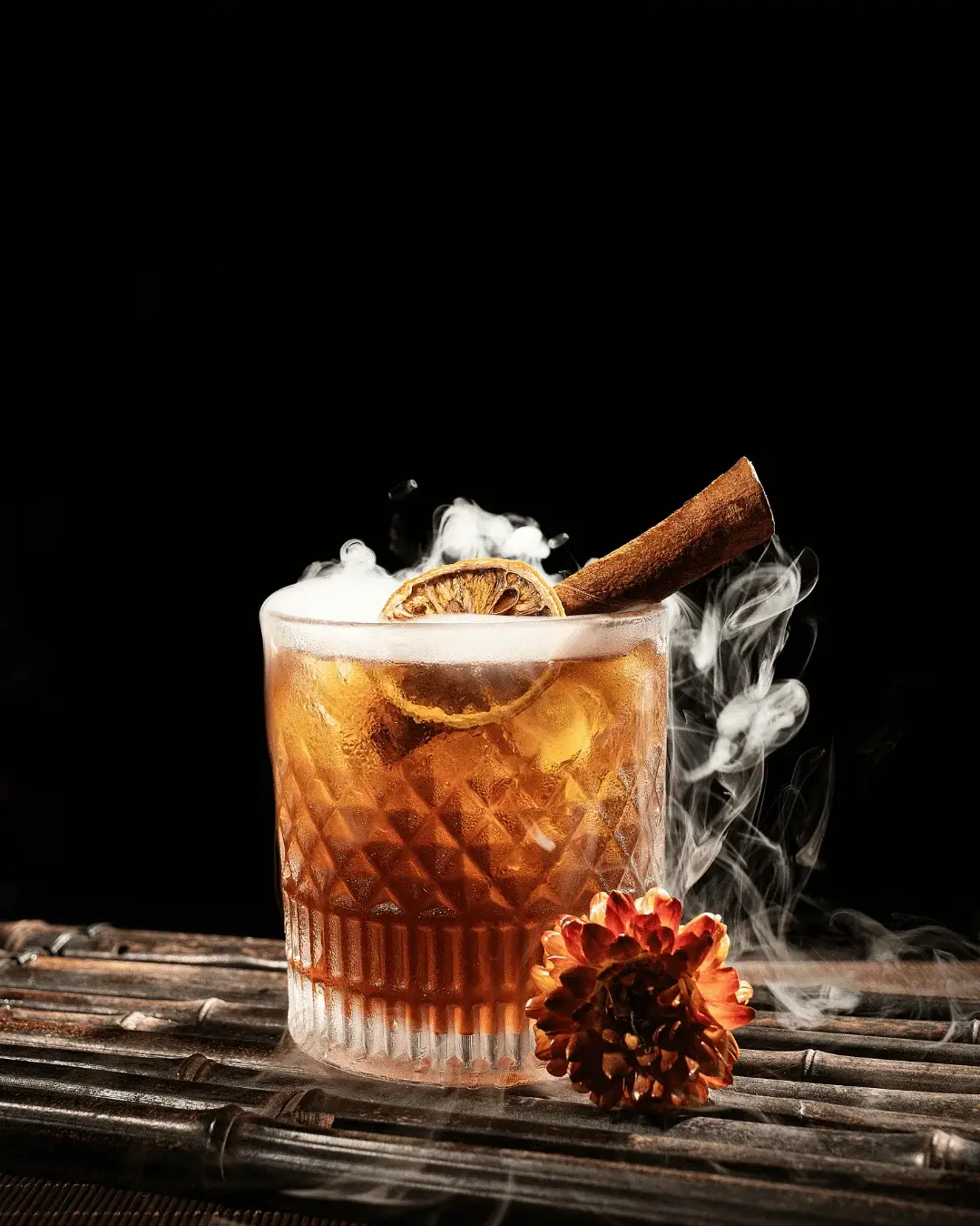 Best mocktails in Dhaka served smoked with cinnamon garnish
