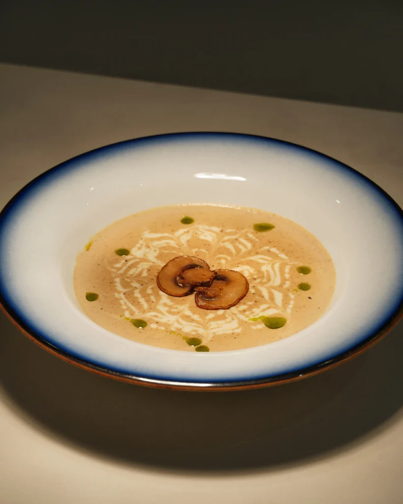 Creamy mushroom soup plated at Gulshan fine dine lakeside restaurant's menu